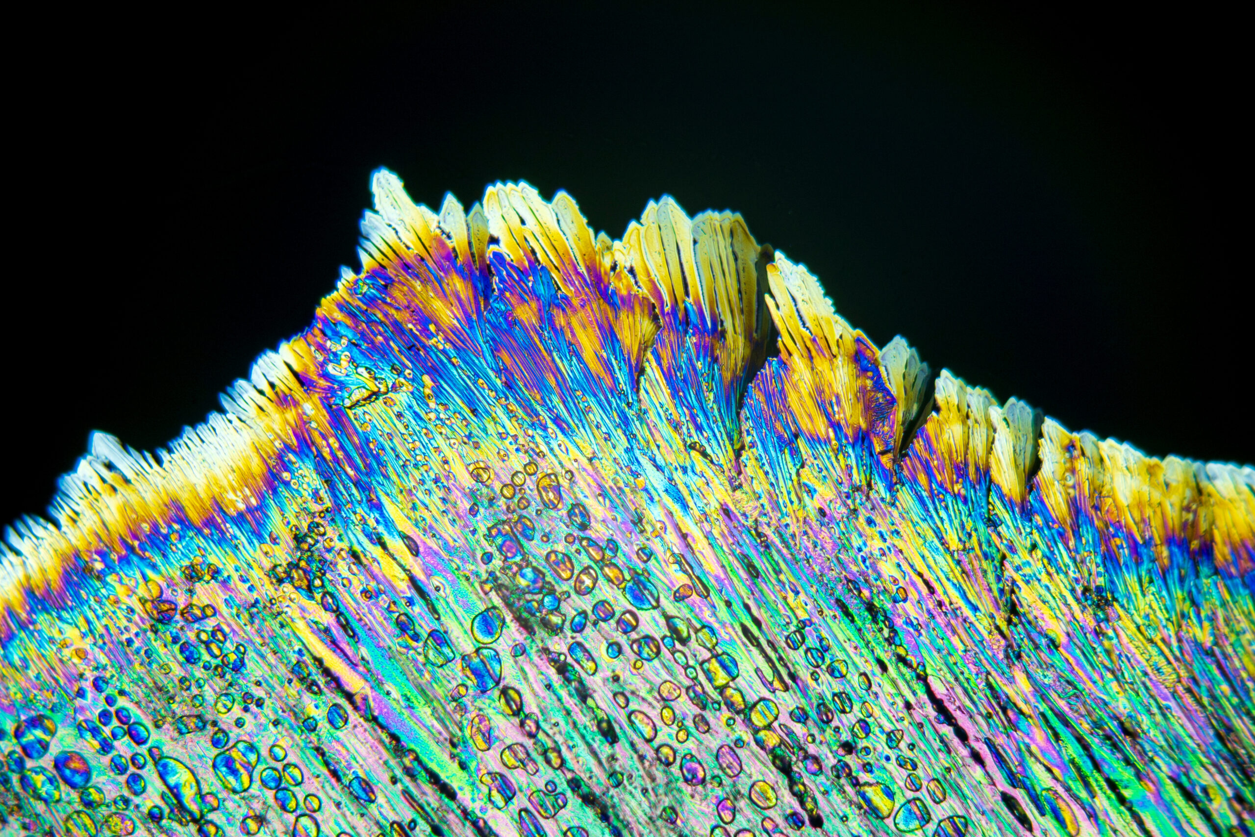 Colorful crystals under microscope, polarization colors, polar filters