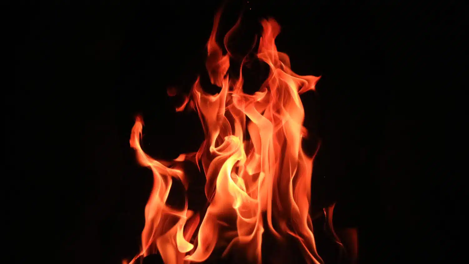 photo shows flames in front of a black backdrop