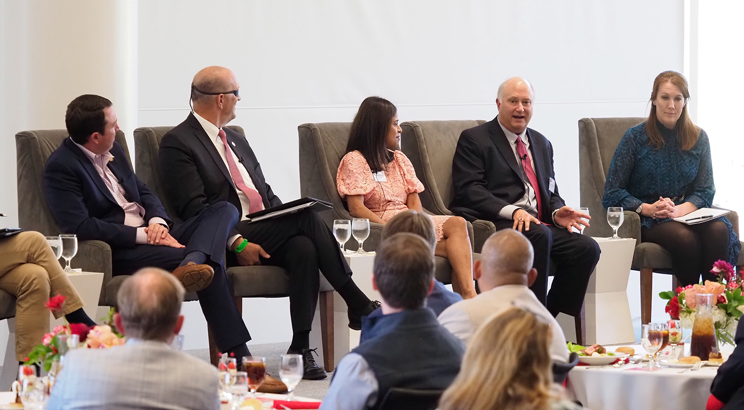 John Palmour, second from right, speaks during a panel discussion at the James B. Hunt Jr. Library on NC State's Centennial Campus in October 2022.