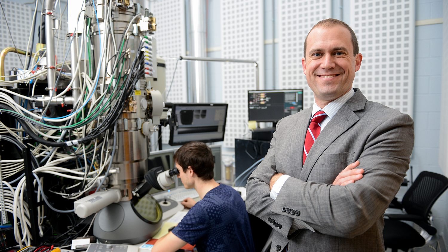 Dr. Jacob Jones, Director, Analytical Instrumentation Facility, with a graduate student at the Titan Microscope on Centennial Campus. Photo by Marc Hall