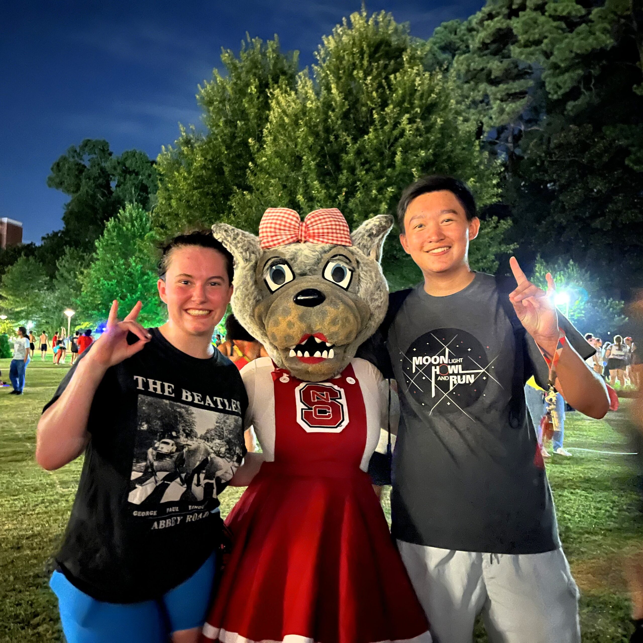 Avery Smith Ms. Wuf: Posing with Ms. Wuf after completing the Moonlight howl and run my freshman year. NC State, August 2023