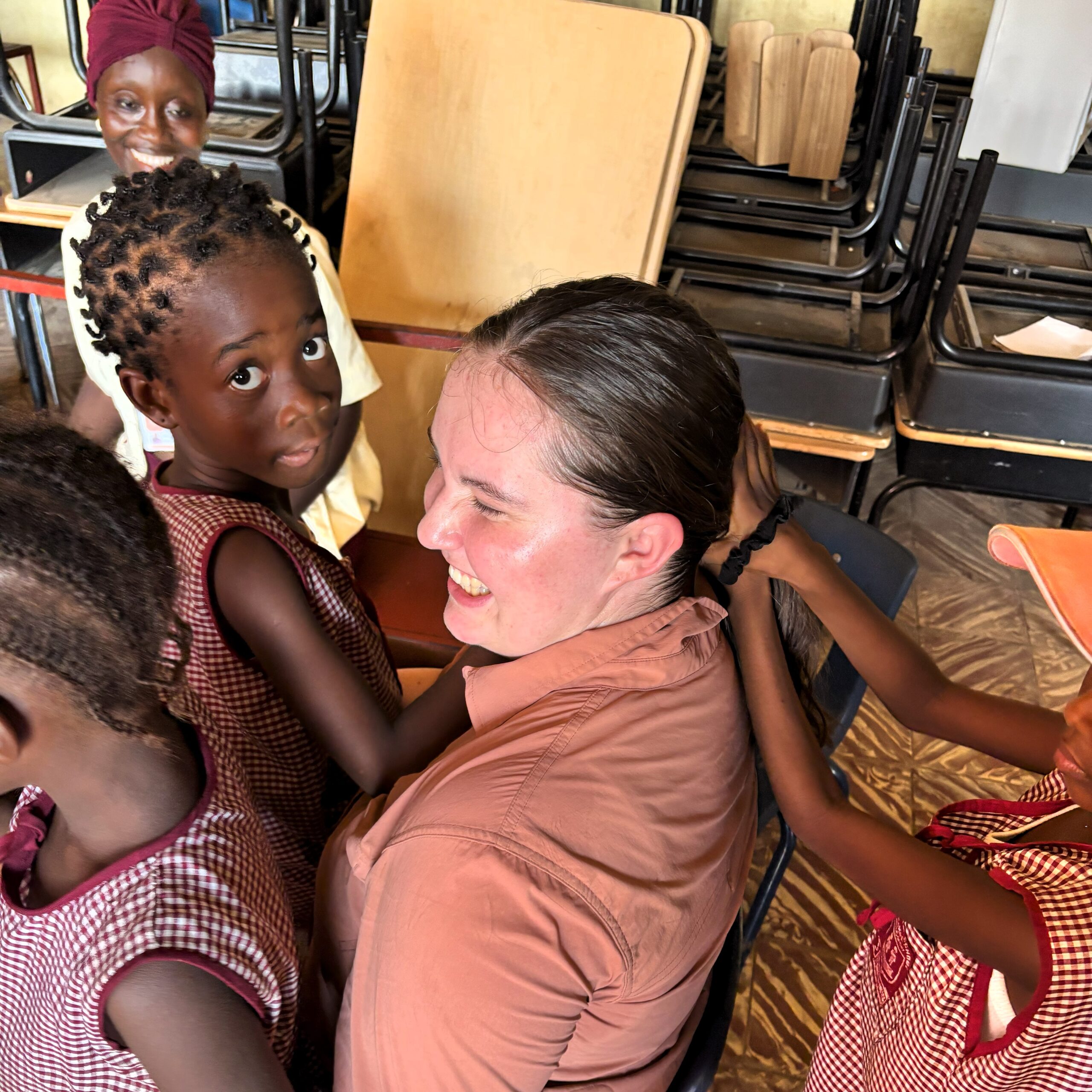 Avery Smith Sierra Leone: Getting my hair done by girls at the Goshen Academy after school. Sierra Leone, Deceomber 2024