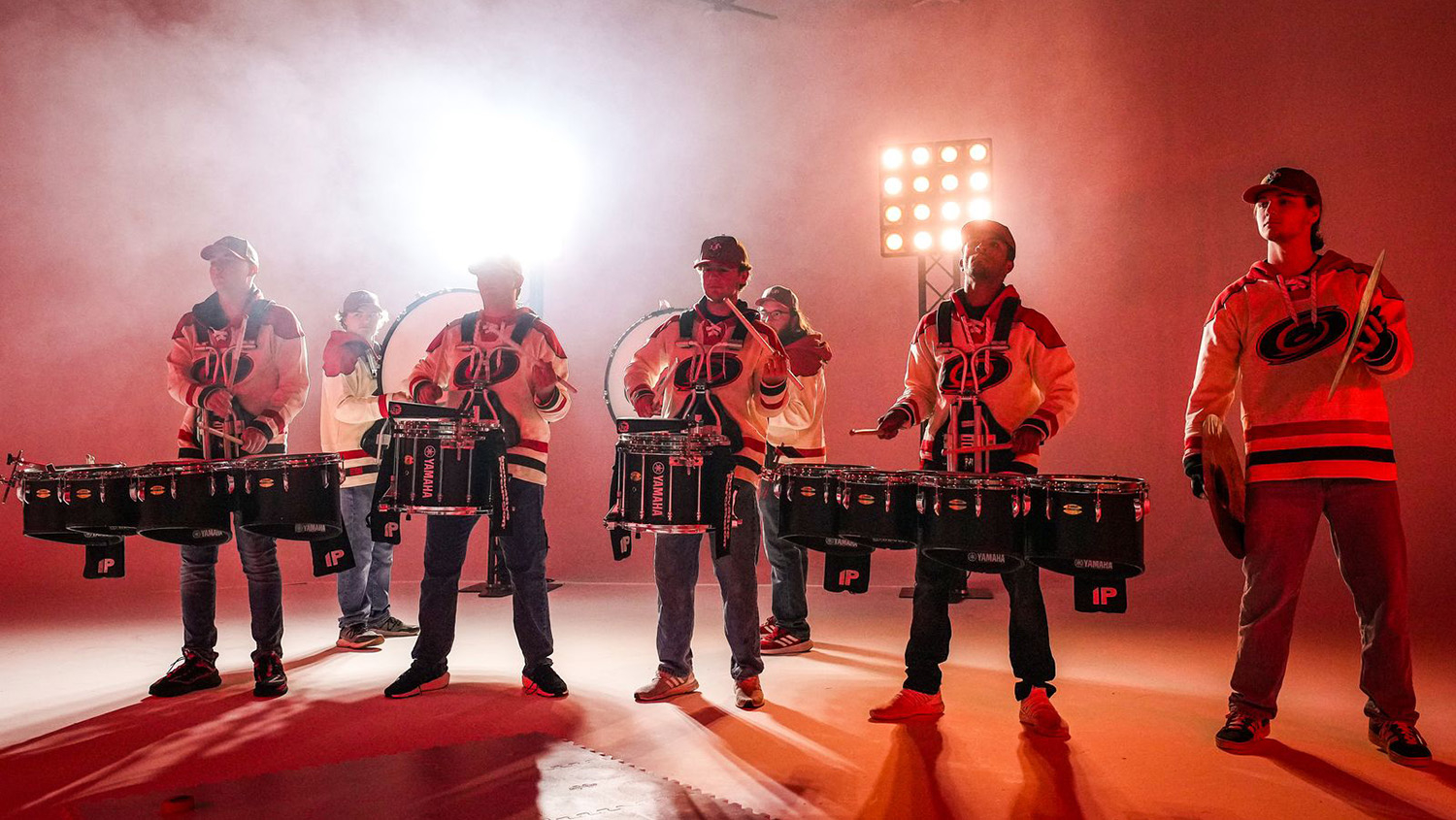 Members of the NC State Marching Band play drums during the Carolina Hurricanes' jersey reveal video.