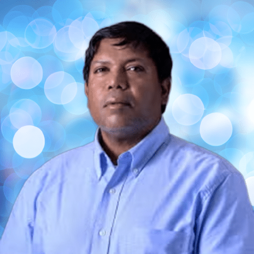 dark haired man wearing blue oxford top