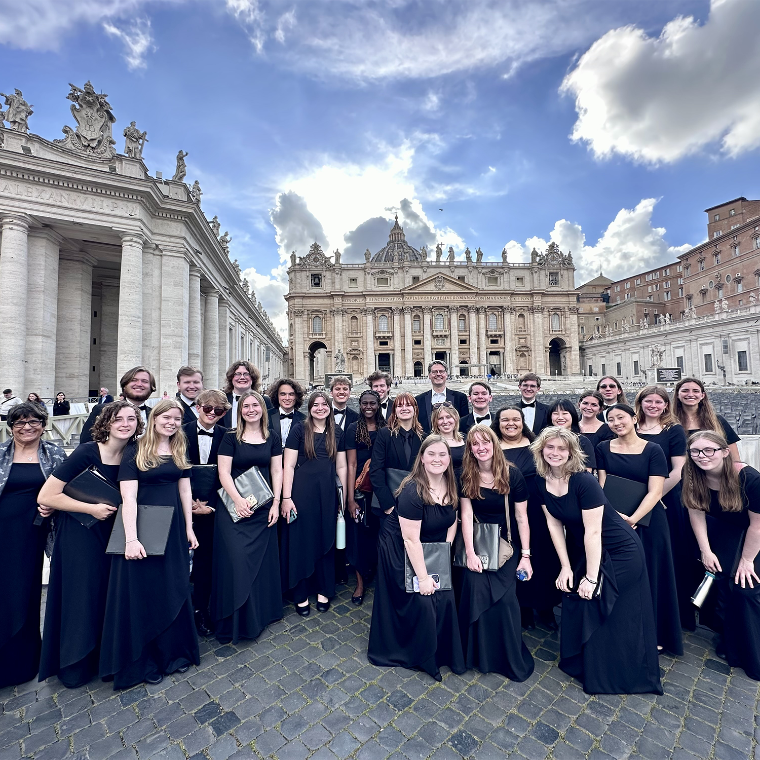 group of chorus singers in black dresses